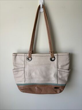 The Sak Two-Tone Leather Tote in Cream and Brown with Teal Accent
